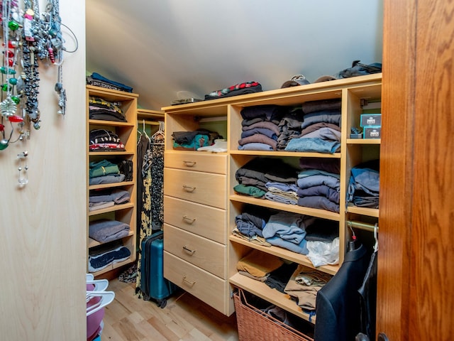 1286 Fairmount Ave, Saint Paul, MN 55105 - walk in closet featuring vaulted ceiling and wood finished floors