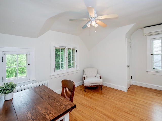 1286 Fairmount Ave, Saint Paul, MN 55105 - office featuring a wall mounted AC, radiator, light wood-type flooring, baseboards, and lofted ceiling