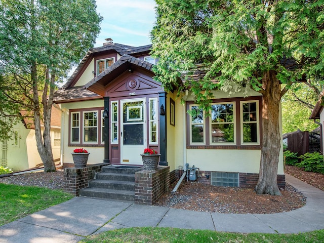 1286 Fairmount Ave, Saint Paul, MN 55105 - view of front of home featuring stucco siding and a chimney