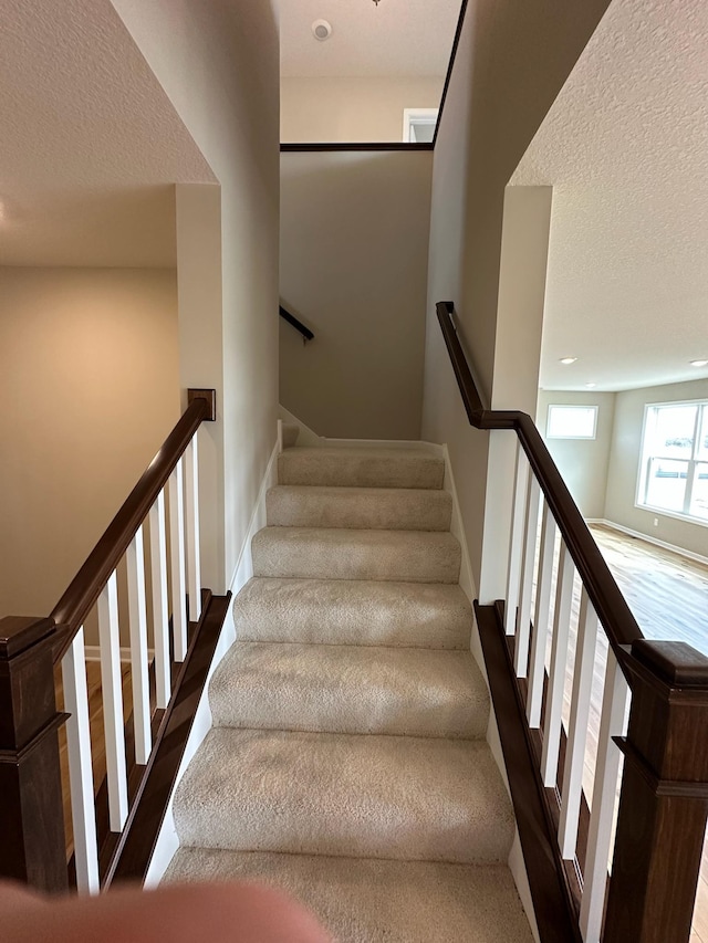 14403 107th Pl N, Maple Grove, MN 55369 - staircase featuring a textured ceiling