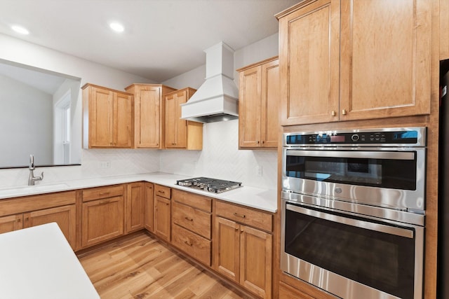 14403 107th Pl N, Maple Grove, MN 55369 - kitchen featuring custom range hood, appliances with stainless steel finishes, light wood finished floors, light countertops, and recessed lighting
