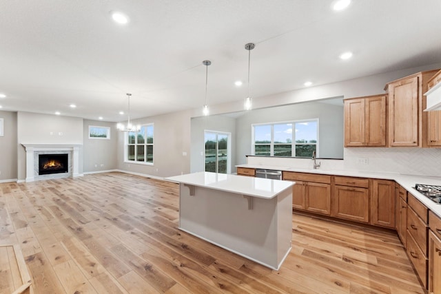 14403 107th Pl N, Maple Grove, MN 55369 - kitchen featuring recessed lighting, light wood-style flooring, stainless steel appliances, light countertops, and a kitchen island