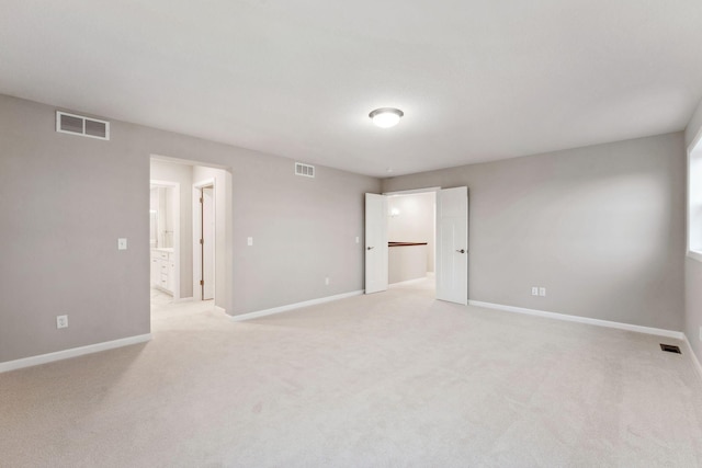 14403 107th Pl N, Maple Grove, MN 55369 - unfurnished bedroom featuring connected bathroom and light colored carpet