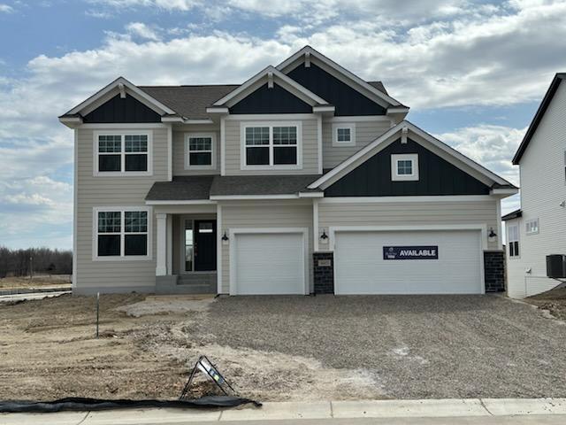 14403 107th Pl N, Maple Grove, MN 55369 - craftsman inspired home with board and batten siding, driveway, and an attached garage