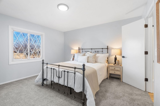 carpeted bedroom with baseboards