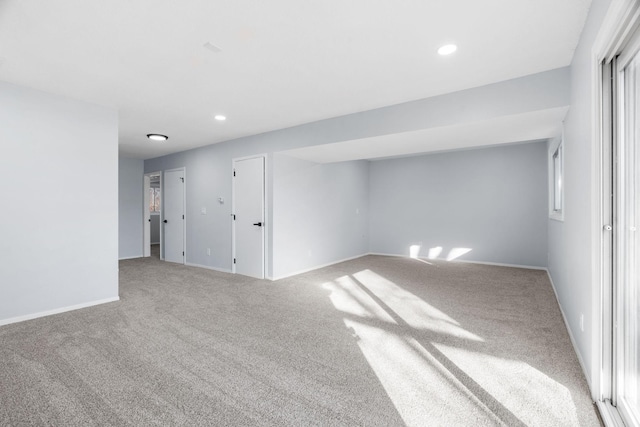 carpeted empty room with recessed lighting and baseboards