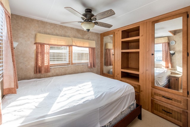 carpeted bedroom with a ceiling fan