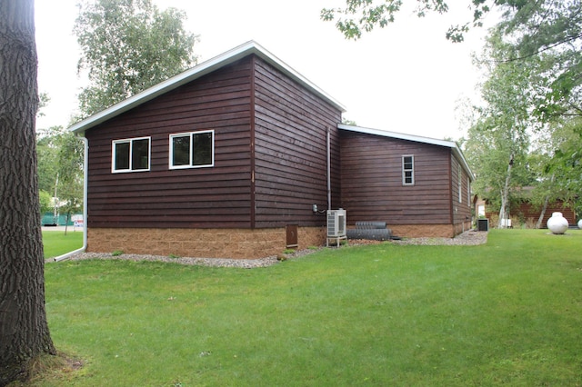 view of side of home featuring a lawn