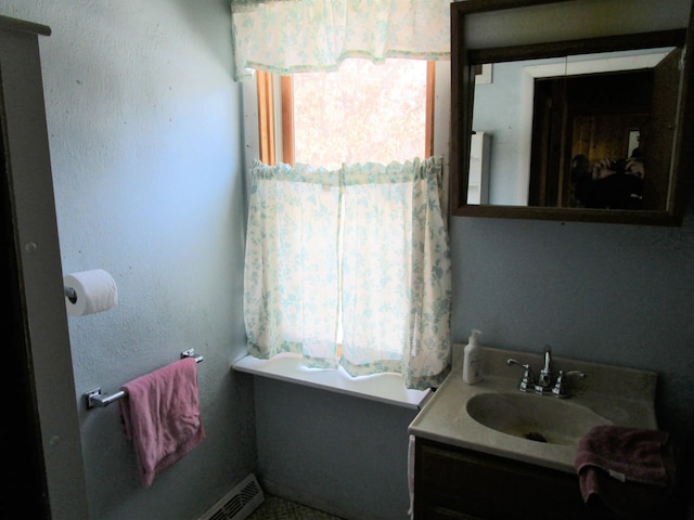 bathroom featuring a wealth of natural light and vanity