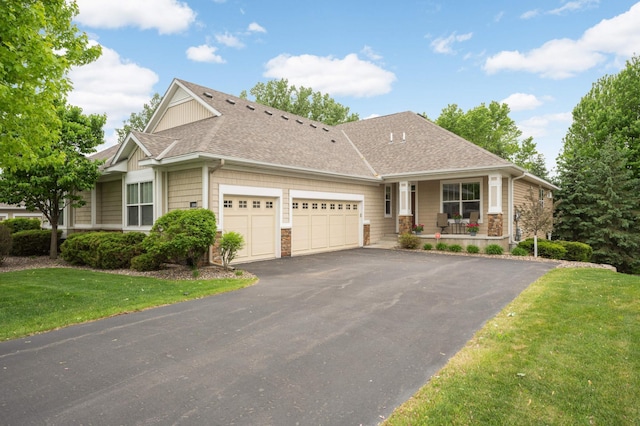 3595 Lemieux Cir, Eagan, MN 55122 - view of front of home featuring a shingled roof, an attached garage, a porch, asphalt driveway, and a front lawn