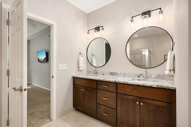3595 Lemieux Cir, Eagan, MN 55122 - full bath featuring double vanity, tile patterned flooring, baseboards, and a shower stall
