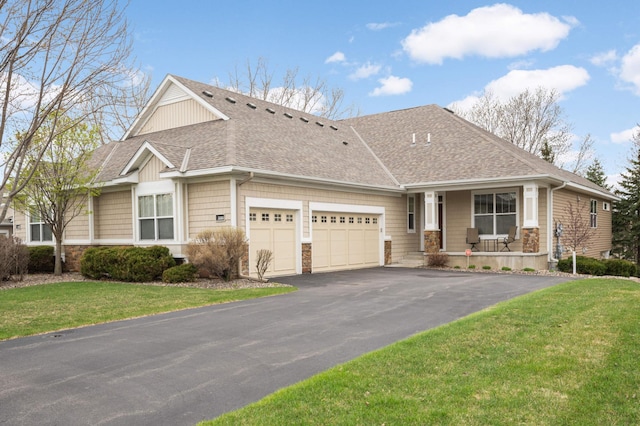3595 Lemieux Cir, Eagan, MN 55122 - craftsman-style home featuring roof with shingles, covered porch, an attached garage, stone siding, and a front lawn