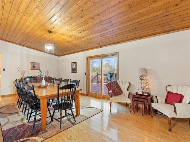 dining area featuring baseboards, wood ceiling, wood finished floors, crown molding, and a notable chandelier