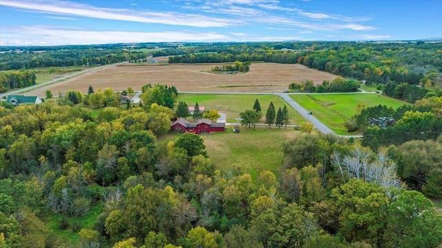 drone / aerial view with a forest view and a rural view