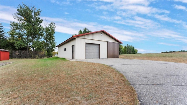 detached garage featuring driveway