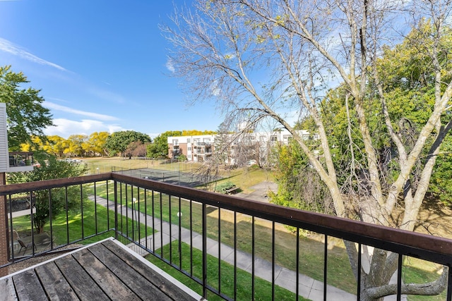 wooden terrace with a lawn