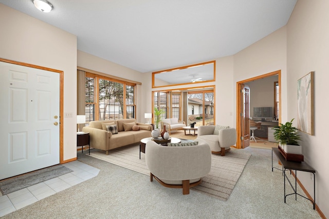 living room with carpet floors and tile patterned floors