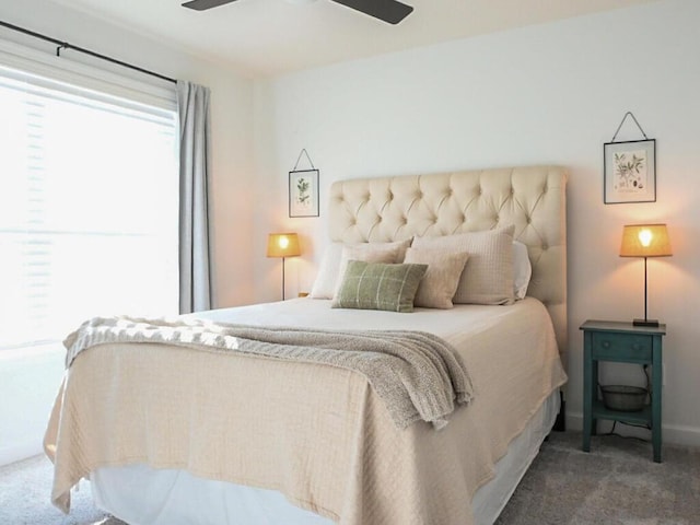 bedroom featuring baseboards, a ceiling fan, and carpet flooring