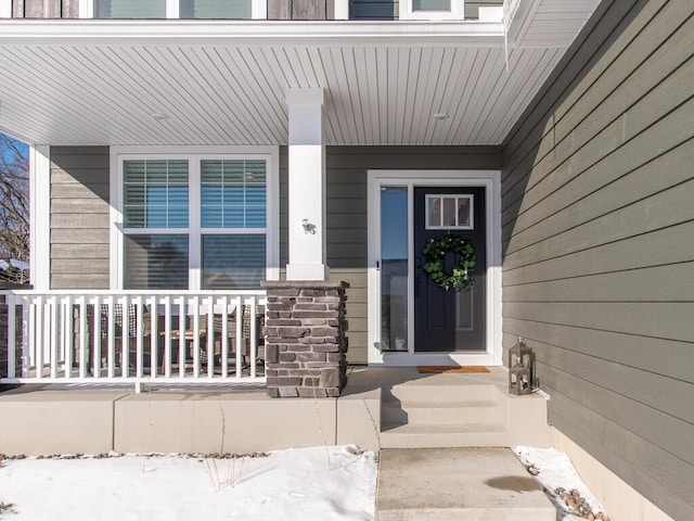 doorway to property featuring a porch