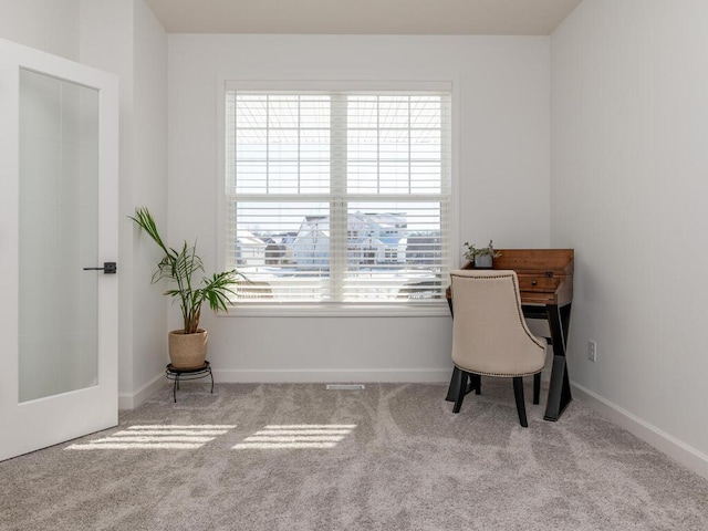 office space featuring carpet flooring and baseboards