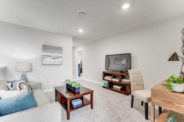 carpeted living room featuring recessed lighting and baseboards