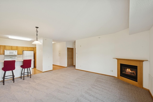 110696 Village Rd Unit 316, Chaska, MN 55318 - living area featuring light carpet, a glass covered fireplace, and baseboards