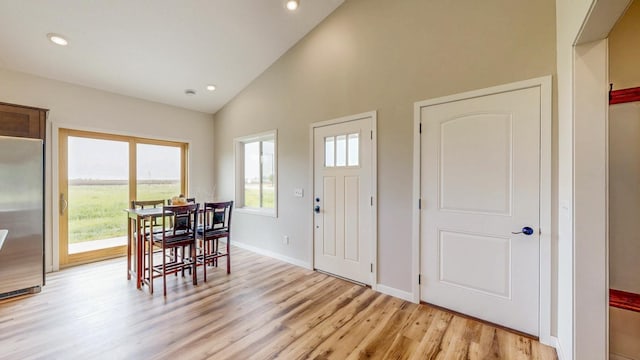 619 6th St, West Concord, MN 55985 - entrance foyer featuring light wood-type flooring, recessed lighting, high vaulted ceiling, and baseboards