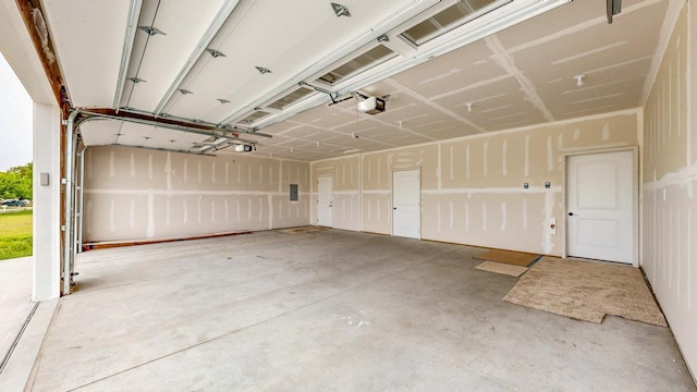 619 6th St, West Concord, MN 55985 - garage with a garage door opener