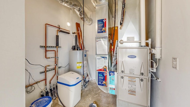 619 6th St, West Concord, MN 55985 - utility room featuring water heater
