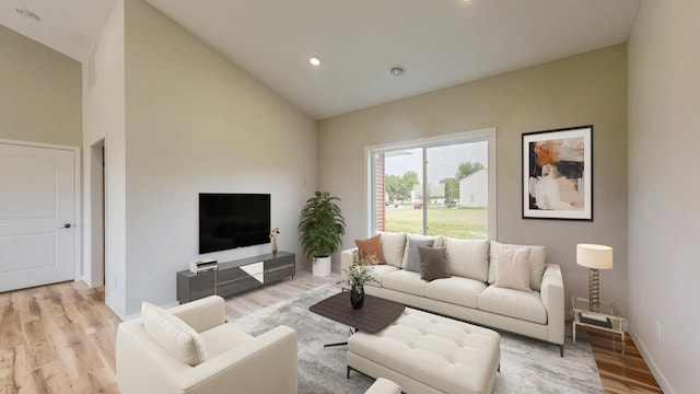 619 6th St, West Concord, MN 55985 - living area with light wood finished floors, recessed lighting, high vaulted ceiling, and baseboards