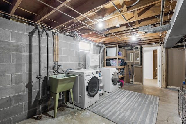 clothes washing area with washing machine and dryer and laundry area