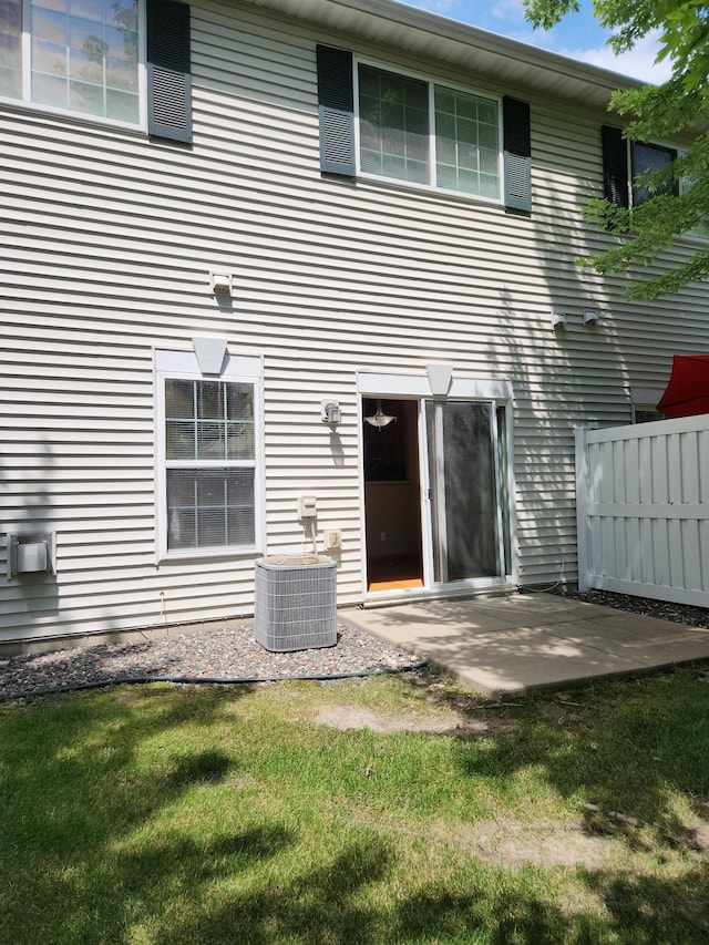 7721 Elm Grove Ave, New Hope, MN 55428 - rear view of property with a patio and cooling unit