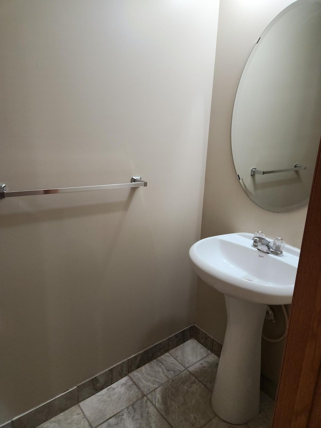 7721 Elm Grove Ave, New Hope, MN 55428 - bathroom with baseboards and a sink