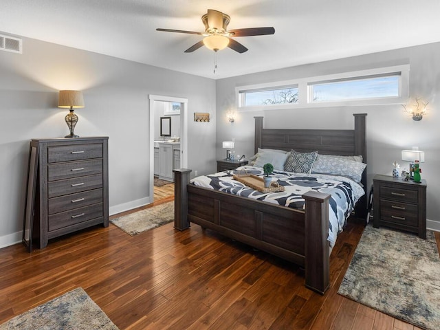 bedroom with a ceiling fan, baseboards, visible vents, and wood finished floors