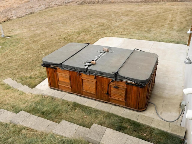 entry to storm shelter with a yard and a hot tub