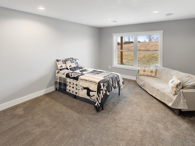 bedroom featuring dark colored carpet, recessed lighting, and baseboards