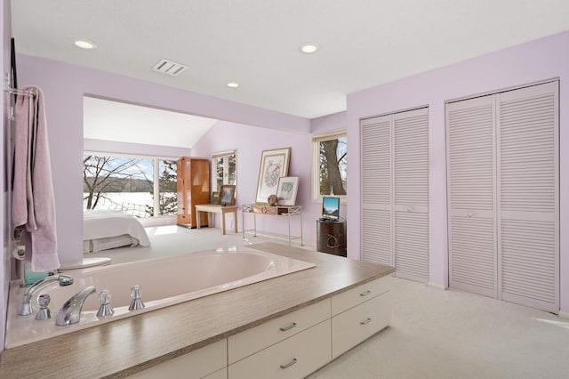 full bath with lofted ceiling, visible vents, a closet, and recessed lighting