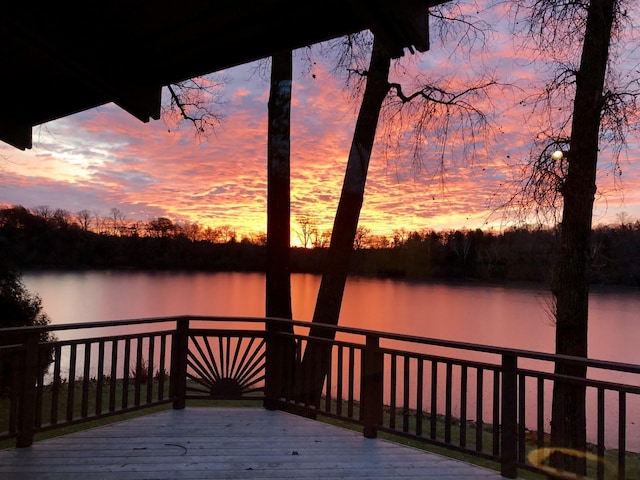 view of dock featuring a deck with water view