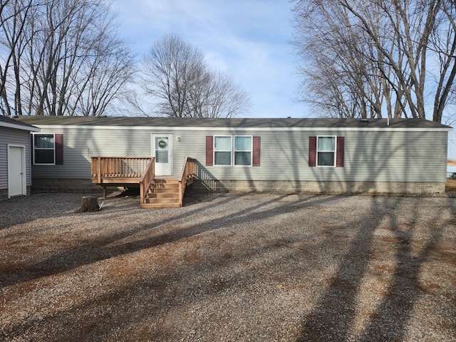 view of front facade featuring a wooden deck