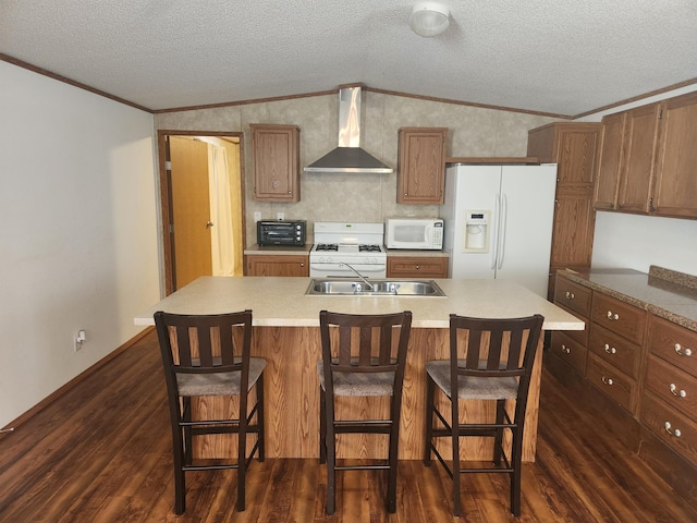 kitchen with white appliances, dark wood-style floors, wall chimney exhaust hood, a textured ceiling, and crown molding