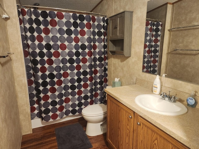 full bath featuring toilet, wood finished floors, vanity, and a shower with curtain