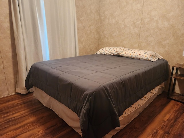 bedroom with wood finished floors