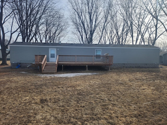 rear view of house featuring a deck