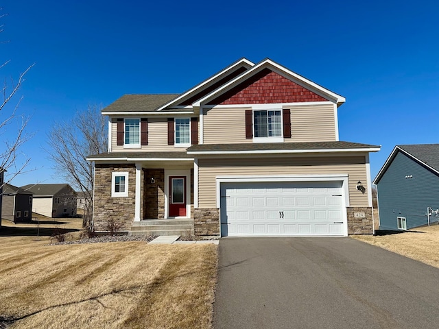 424 Wildflower Ct, Waverly, MN 55390 - craftsman house featuring stone siding, aphalt driveway, and an attached garage