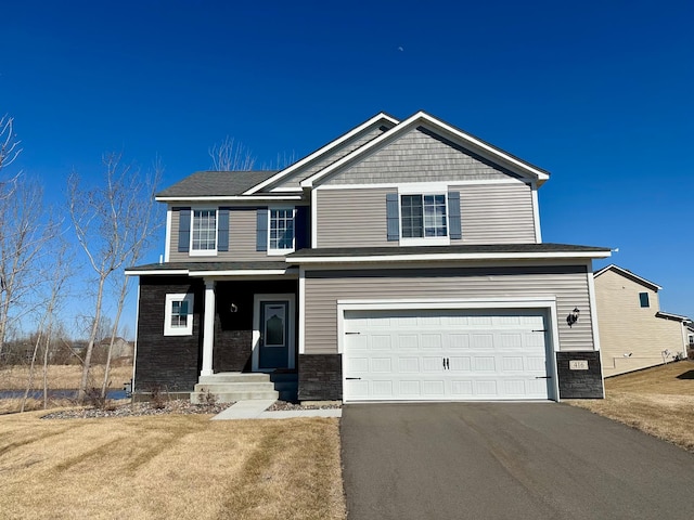 416 Tanner Dr, Waverly, MN 55390 - craftsman house with aphalt driveway and an attached garage
