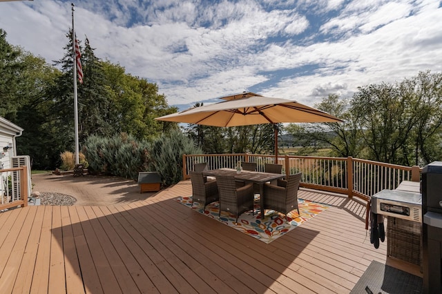 deck featuring outdoor dining area