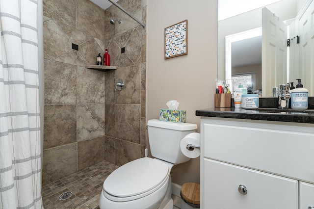 full bath with a shower stall, toilet, and vanity