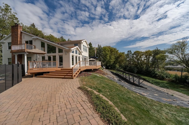 exterior space with a chimney and a deck