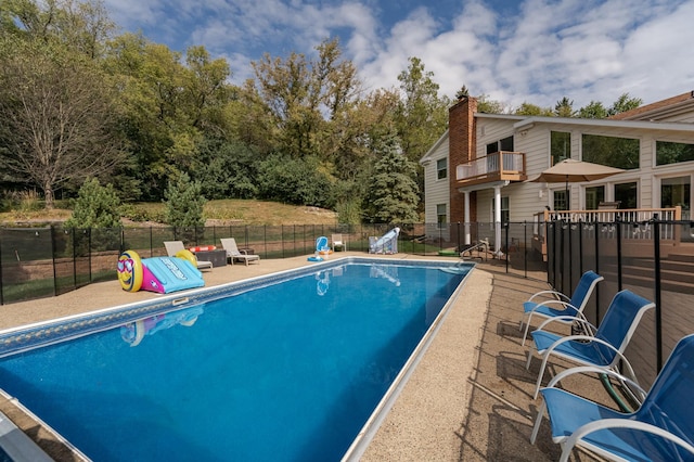 view of pool with fence, a fenced in pool, and a patio