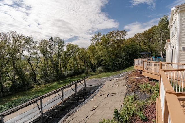 surrounding community with a wooden deck